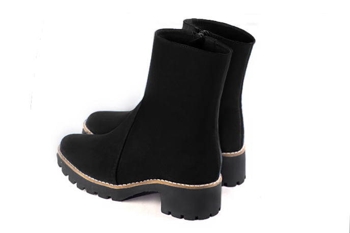 Matt black women's ankle boots with a zip on the inside. Round toe. Low rubber soles. Rear view - Florence KOOIJMAN